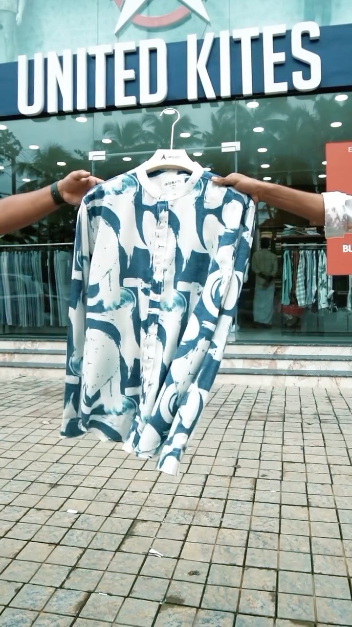 United Kites storefront with a printed shirt held up